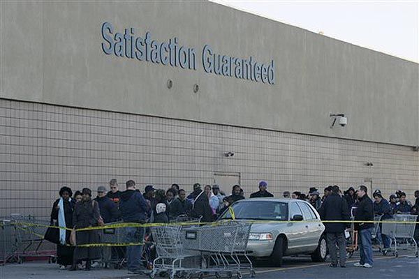 Shoppers wait to be let back into the Wal-Mart